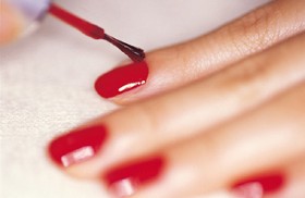 Painting Nails with Red Nail Paint